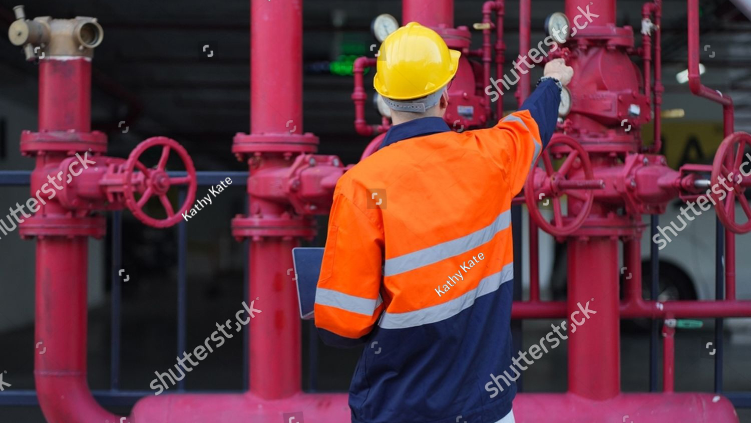 stock photo male engineer inspects water pipelines in the engineering system area of the factory outside where 2601132863