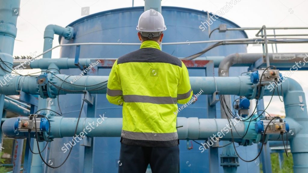 stock photo engineer or technician maintenance checking technical data of system equipment condenser water pump 2453620101