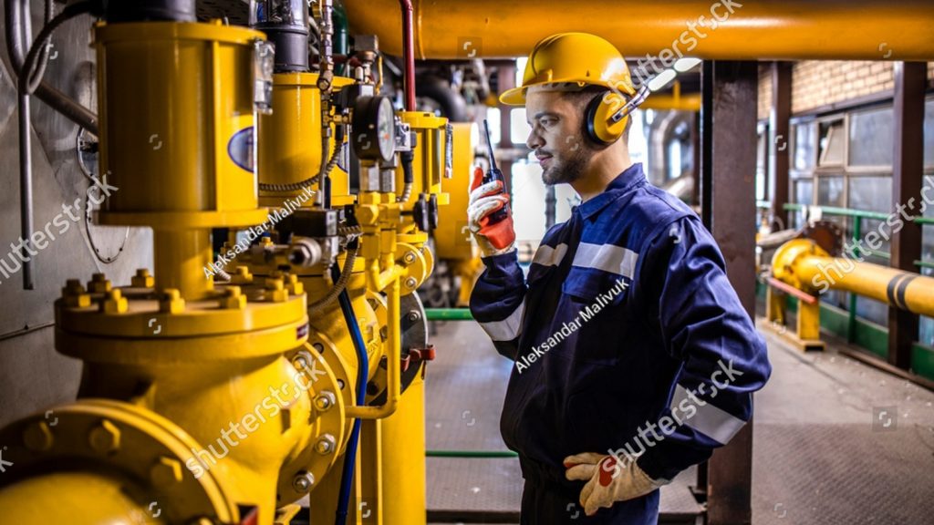 stock photo power generation plant worker controlling crude oil and gas processing 2221716909